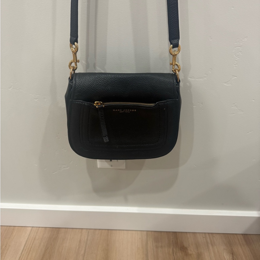 Marc Jacobs black leather crossbody purse! Cute and classic:)